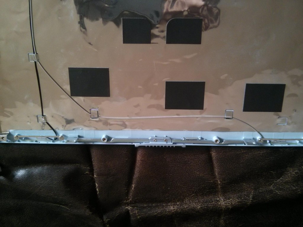 Antenna guides along screen chassis